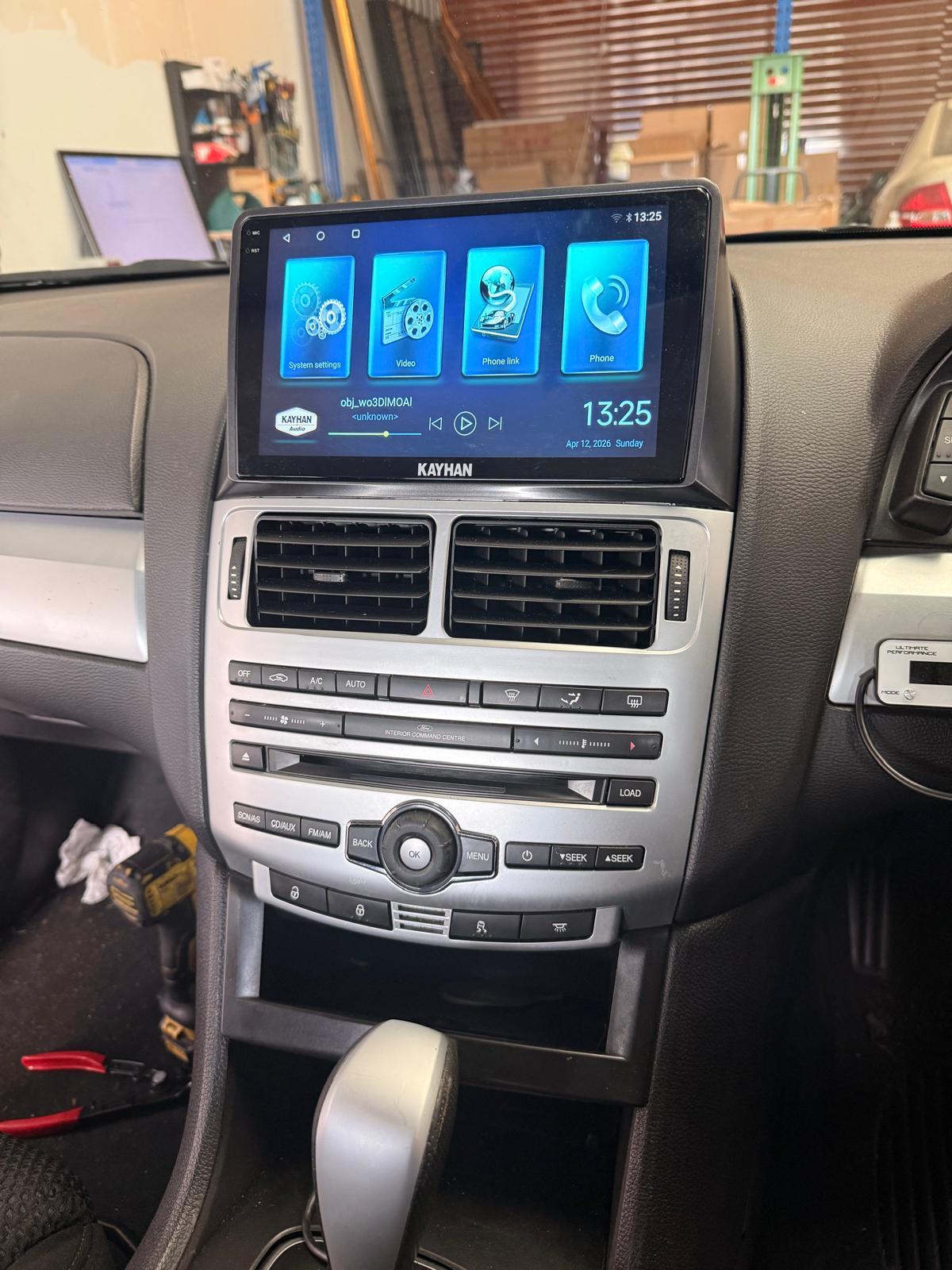 Kayhan Audio Version 6 head unit home screen installed in Ford Falcon FG MK1 showing Navigation, Music, Radio and App menu