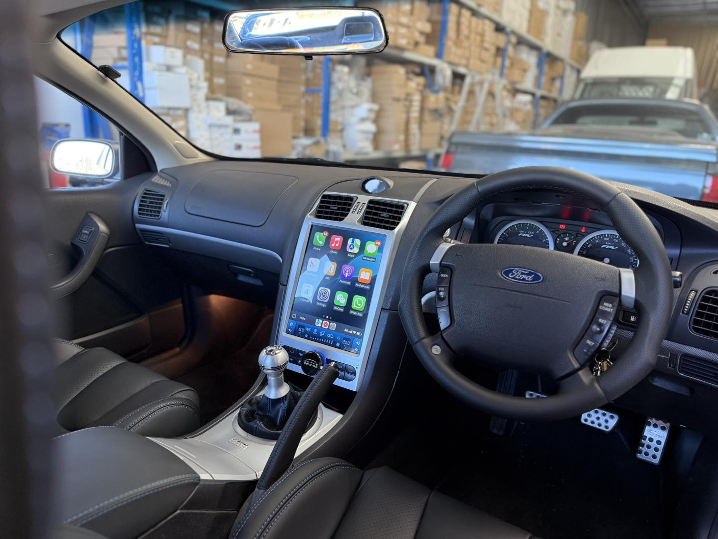 Kayhan Audio vertical touchscreen head unit with Apple CarPlay installed in a Ford FPV dash